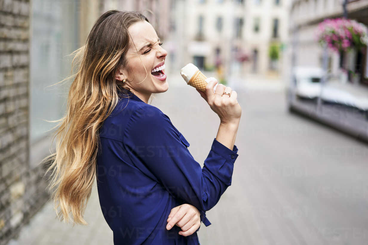 Beautiful Woman Having Fun Singing To Ice Cream Cone